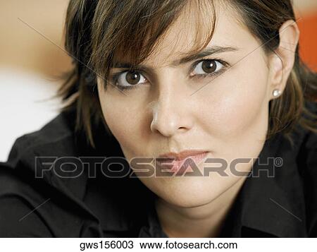 Stock Image - Portrait of a businesswoman thinking. Fotosearch