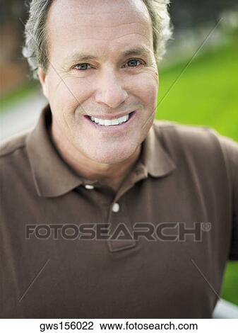 Portrait of a mature man smiling View Large Photo Image Stock Image - Portrait of a mature man smiling. Fotosearch
