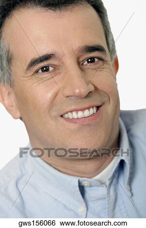 Portrait of a mature man smiling View Large Photo Image Stock Photograph - Portrait of a mature man smiling. Fotosearch