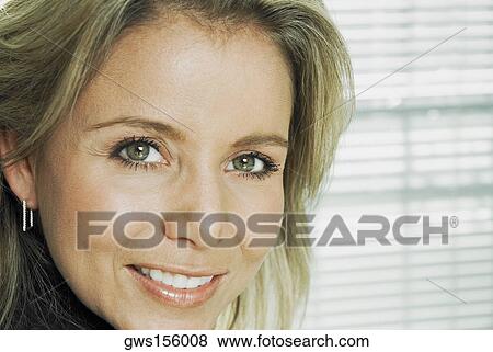 Portrait of a mid adult woman smiling View Large Photo Image Stock Photo - Portrait of a mid adult woman smiling. Fotosearch
