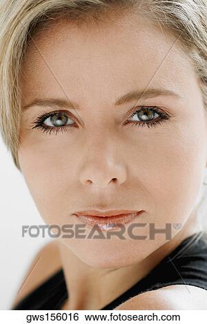 Stock Photograph - Portrait of a mid adult woman. Fotosearch