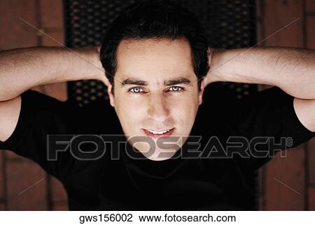 Portrait of a young man doing sit-ups on a weight bench View Large Photo Image Stock Image - Portrait of a young man doing sit-ups on a weight bench. Fotosearch