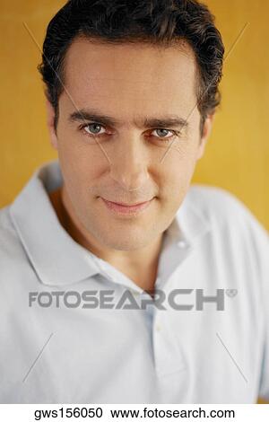 Portrait of a young man smirking View Large Photo Image Stock Image - Portrait of a young man smirking. Fotosearch