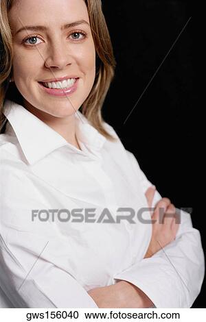 Stock Image - Portrait of a young woman smiling. Fotosearch