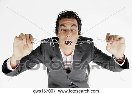 Close-up of a businessman holding a chain of paper clips View Large Photo Image Stock Photo - Close-up of a businessman holding a chain of paper clips. Fotosearch