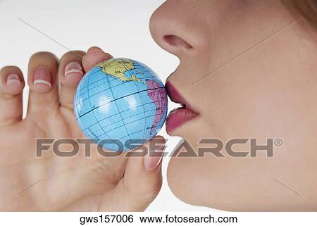 Close-up of a businesswoman kissing a globe View Large Photo Image Stock Photograph - Close-up of a businesswoman kissing a globe. Fotosearch