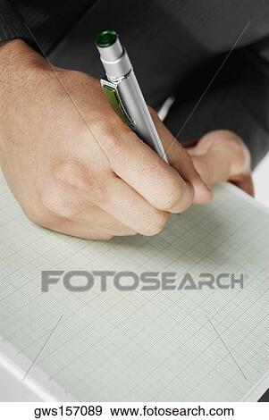 Close-up of a man's hand holding a pen View Large Photo Image Stock Photo - Close-up of a man's hand holding a pen. Fotosearch