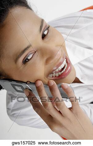 High angle view of a businesswoman talking on a mobile phone View Large Photo Image Stock Photography - High angle view of a businesswoman talking on a mobile phone. Fotosearch