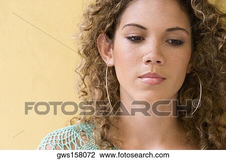 Close-up of a teenage girl thinking View Large Photo Image Stock Image - Close-up of a teenage girl thinking. Fotosearch