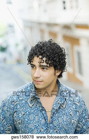Stock Photo - Close-up of a young man looking sideways. Fotosearch