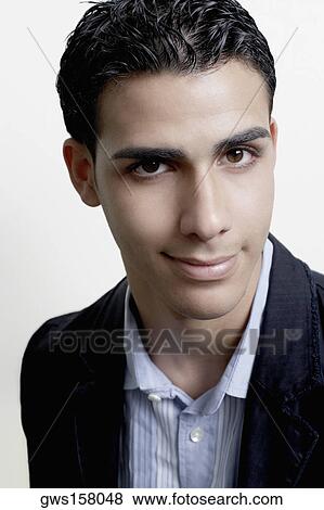 Stock Photo - Portrait of a businessman smirking. Fotosearch