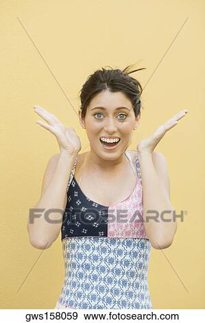 Stock Photo - Portrait of a teenage girl looking surprised. Fotosearch