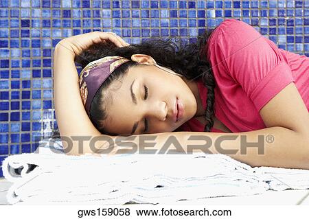 Close-up of a young woman sleeping View Large Photo Image Stock Photo - Close-up of a young woman sleeping. Fotosearch