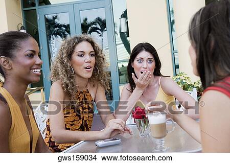 Four teenage girls sitting together and gossiping View Large Photo Image Picture - Four teenage girls sitting together and gossiping. Fotosearch
