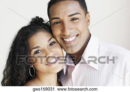 Portrait of a young couple smiling View Large Photo Image Stock Image - Portrait of a young couple smiling. Fotosearch