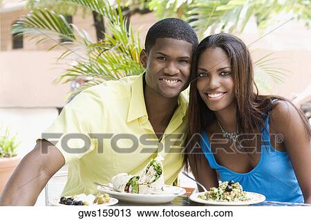 Portrait of a young man and a teenage girl sitting in a restaurant View Large Photo Image Stock Image - Portrait of a young man and a teenage girl sitting in a restaurant. Fotosearch