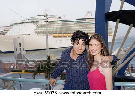 Portrait of a young man standing with a teenage girl View Large Photo Image Stock Photograph - Portrait of a young man standing with a teenage girl. Fotosearch