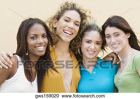 Portrait of four teenage girls smiling View Large Photo Image Stock Image - Portrait of four teenage girls smiling. Fotosearch