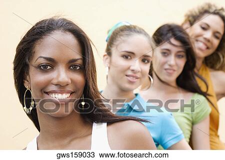 Portrait of four teenage girls smiling View Large Photo Image Stock Image - Portrait of four teenage girls smiling. Fotosearch