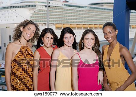 Portrait of two teenage girls and three young women standing side by side View Large Photo Image Stock Photo - Portrait of two teenage girls and three young women standing side by side. Fotosearch