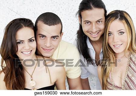 Portrait of two young couples smiling View Large Photo Image Stock Image - Portrait of two young couples smiling. Fotosearch