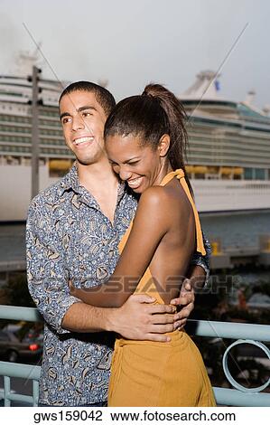Young man and a teenage girl embracing each other View Large Photo Image Stock Image - Young man and a teenage girl embracing each other. Fotosearch
