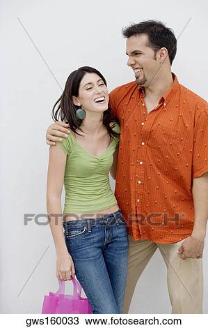 Close-up of a mid adult man with his arm around a teenage girl View Large Photo Image Stock Image - Close-up of a mid adult man with his arm around a teenage girl. Fotosearch