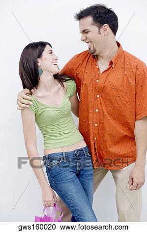 Close-up of a teenage girl and a mid adult man looking at each other View Large Photo Image Stock Image - Close-up of a teenage girl and a mid adult man looking at each other. Fotosearch