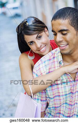 Close-up of a teenage girl embracing a young man from behind View Large Photo Image Stock Photo - Close-up of a teenage girl embracing a young man from behind. Fotosearch