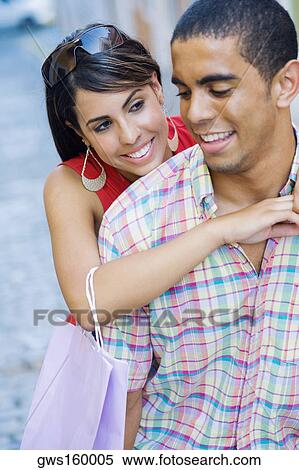 Close-up of a teenage girl embracing a young man from behind View Large Photo Image Stock Photography - Close-up of a teenage girl embracing a young man from behind. Fotosearch