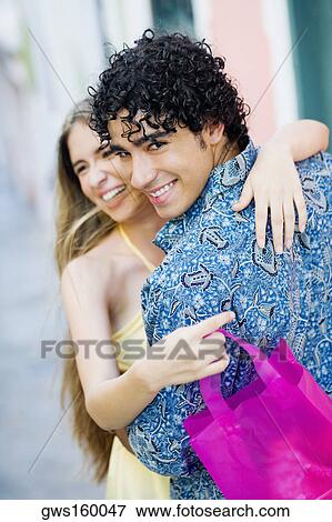 Stock Photo - Close-up of a young man and a teenage girl embracing each other. Fotosearch