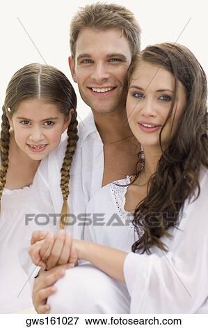 Portrait of a young couple and their daughter smiling View Large Photo Image Stock Photo - Portrait of a young couple and their daughter smiling. Fotosearch