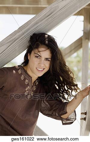 Stock Image - Portrait of a young woman smiling. Fotosearch