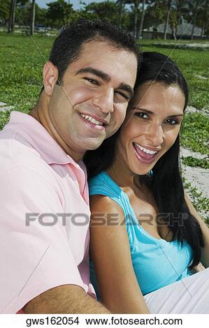Portrait of a young couple smiling View Large Photo Image Picture - Portrait of a young couple smiling. Fotosearch