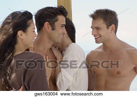 Close-up of a group of people smiling View Large Photo Image Picture - Close-up of a group of people smiling. Fotosearch