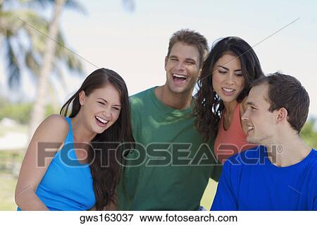 Close-up of two young couples smiling View Large Photo Image Stock Photo - Close-up of two young couples smiling. Fotosearch