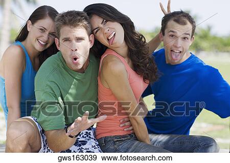 Portrait of two young couples making faces View Large Photo Image Stock Photo - Portrait of two young couples making faces. Fotosearch