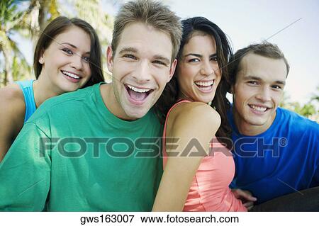 Portrait of two young couples smiling View Large Photo Image Stock Photo - Portrait of two young couples smiling. Fotosearch