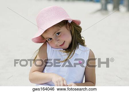 Close-up of a girl smiling on the beach View Large Photo Image Stock Photograph - Close-up of a girl smiling on the beach. Fotosearch