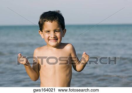 Portrait of a boy clenching her teeth View Large Photo Image Stock Image - Portrait of a boy clenching her teeth. Fotosearch