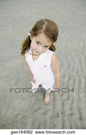 Portrait of a girl standing on the beach View Large Photo Image Stock Image - Portrait of a girl standing on the beach. Fotosearch