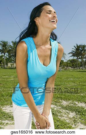 Stock Photograph - Close-up of a young woman smiling. Fotosearch