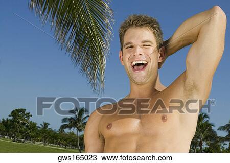 Portrait of a young man laughing View Large Photo Image Stock Image - Portrait of a young man laughing. Fotosearch