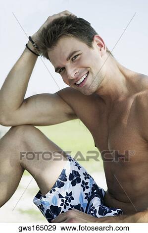 Portrait of a young man smiling View Large Photo Image Stock Photo - Portrait of a young man smiling. Fotosearch