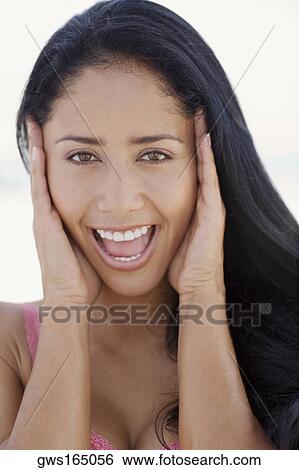 Portrait of a young woman laughing View Large Photo Image Stock Photograph - Portrait of a young woman laughing. Fotosearch