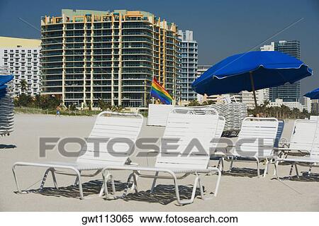 Beach chairs and umbrellas on the beach View Large Photo Image Stock Photography - Beach chairs and umbrellas on the beach. Fotosearch