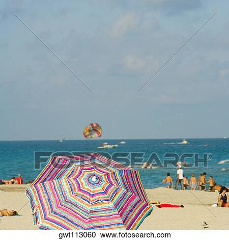 Beach umbrella on the beach View Large Photo Image Stock Image - Beach umbrella on the beach. Fotosearch