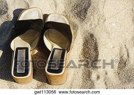 Stock Photograph - Close-up of a pair of sandals. Fotosearch