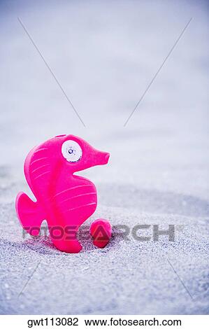 Stock Image - Close-up of a toy on the beach. Fotosearch