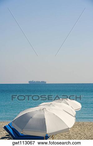 High angle view of beach umbrellas on the beach View Large Photo Image Stock Photo - High angle view of beach umbrellas on the beach. Fotosearch